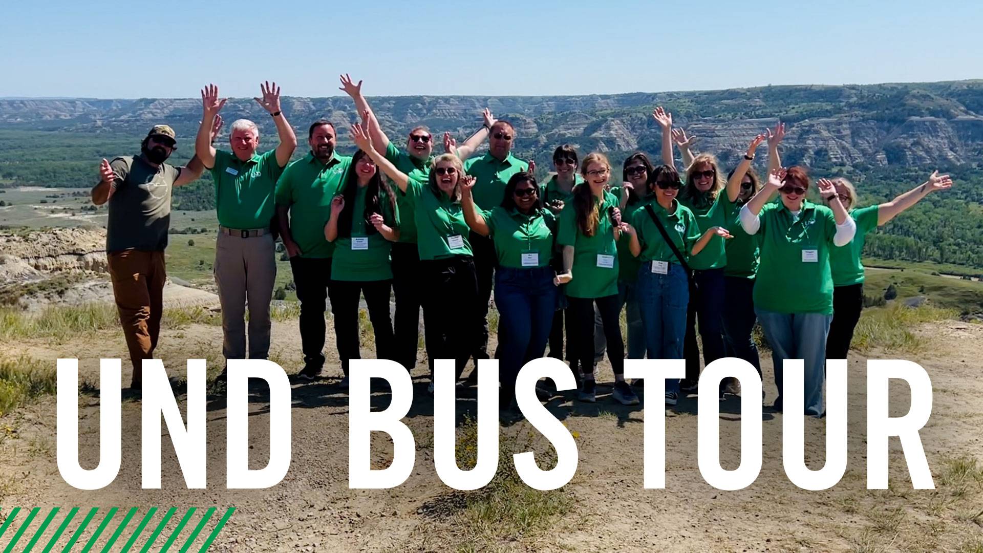 UND bus tour participants celebrate