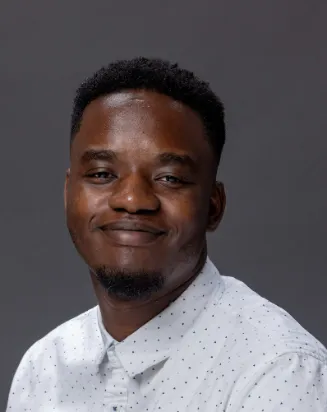 Headshot of Dami Ajayi