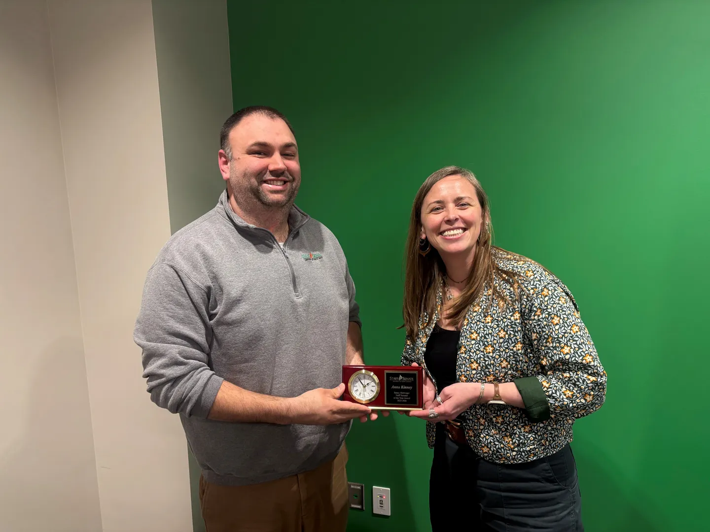 Anna Kinney being presented the award by Staff Senate President Brandon Wallace